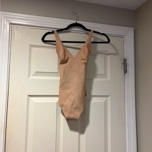 Skims Body Unlined Plunge Thong Bodysuit in Clay XS